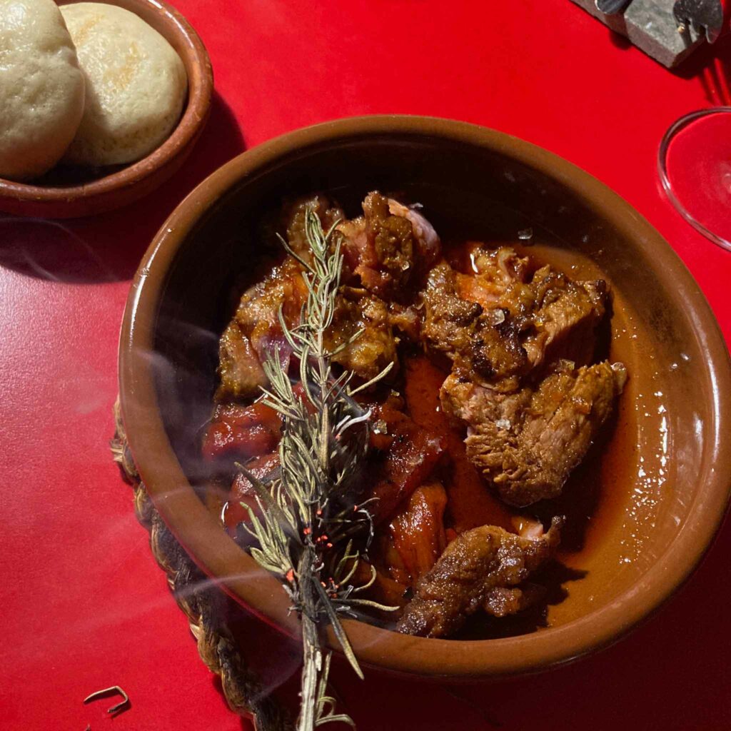 Grilled pork with smoking rosemary at Dos Perot's restaurant in Barcelona